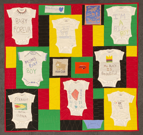 A onsie T-shirt quilt with a Too Cool T-shirt Quilt